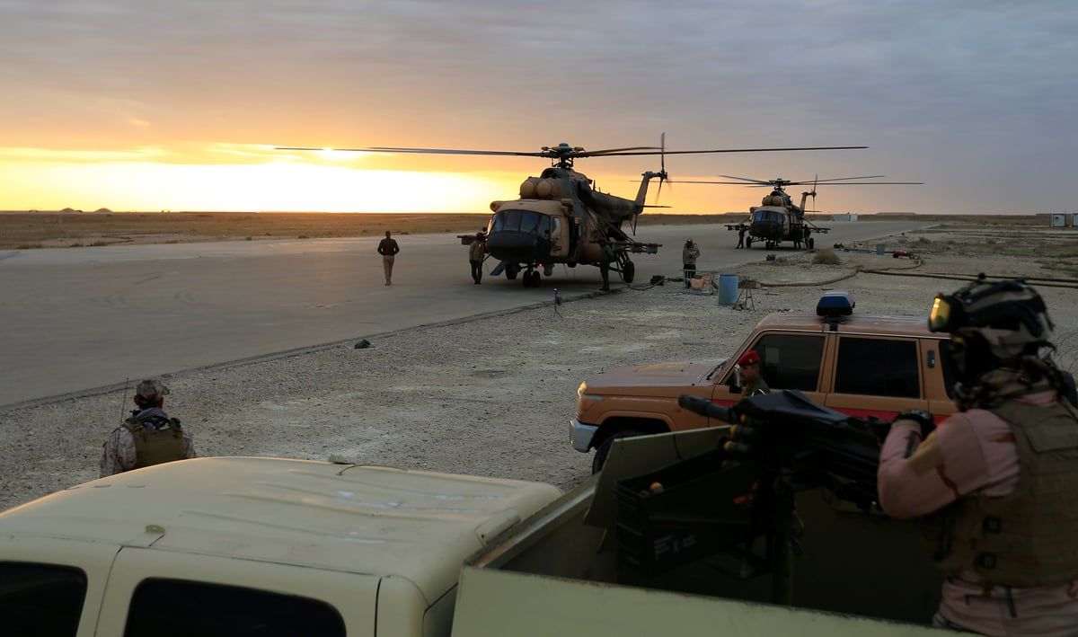 مصادر: تصاعد النيران بقاعدة "عين الأسد" بعد قصفها بمسيرات انتحارية