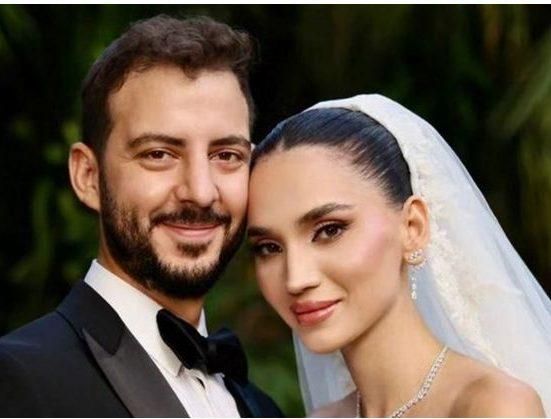 رقصت مع عريسها بطريقة غريبة.. ملكة جمال لبنان السابقة كالأميرات في زفافها وفنان شهير يُغني لهما (فيديو)