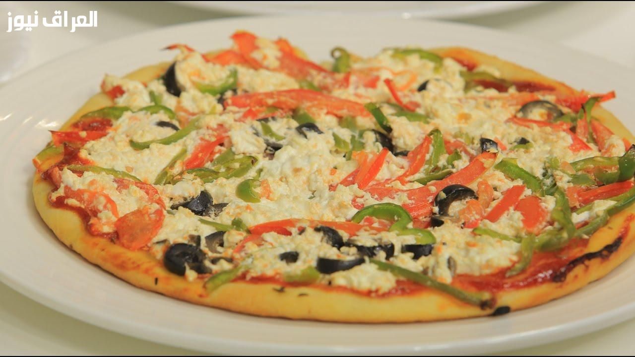 المطبخ منور.. طريقة عمل البيتزا الإيطالي بالجبنة الذائبة طعمها جنان